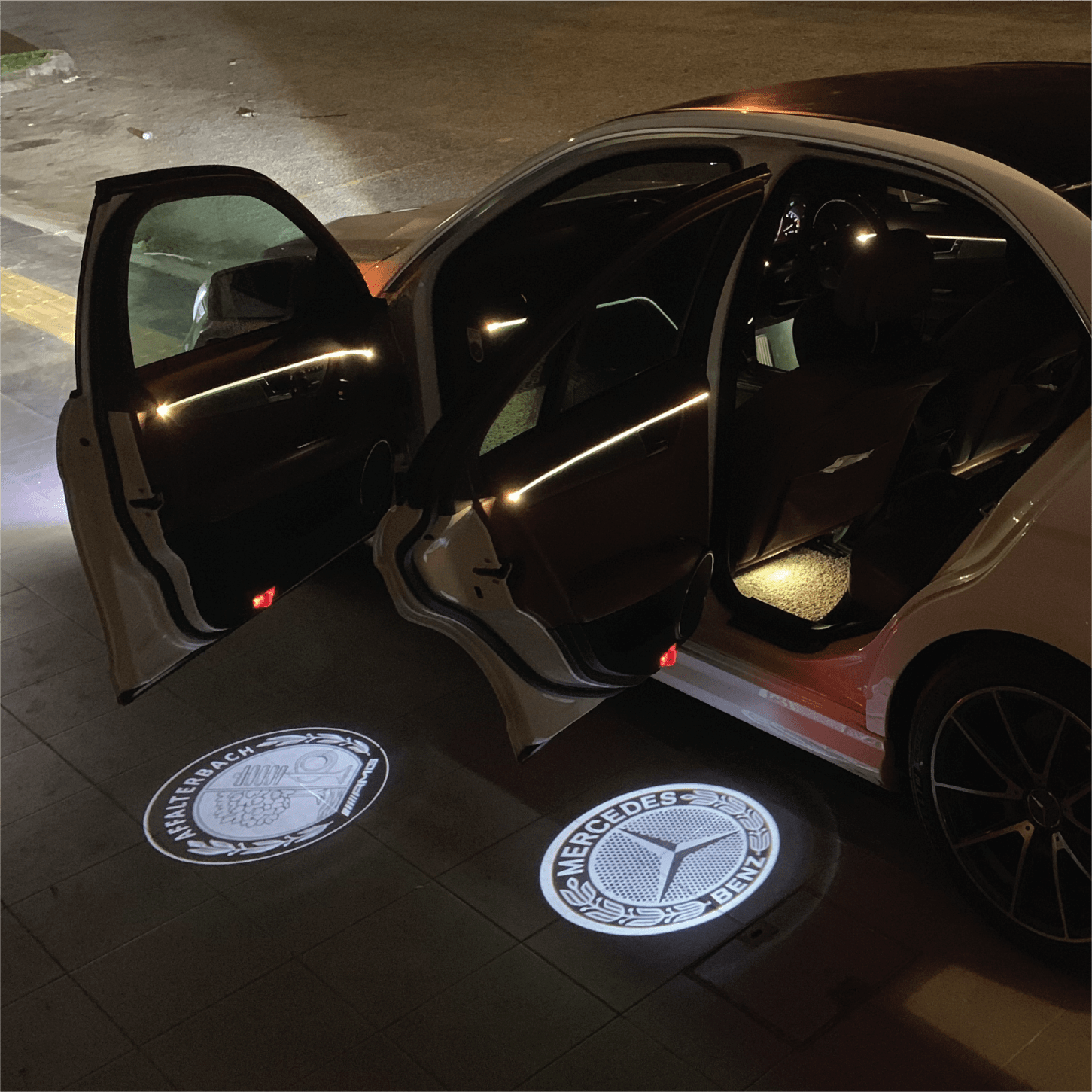 Logo projection on all 4 doors and seat ambient lightning installed :  r/mercedes_benz
